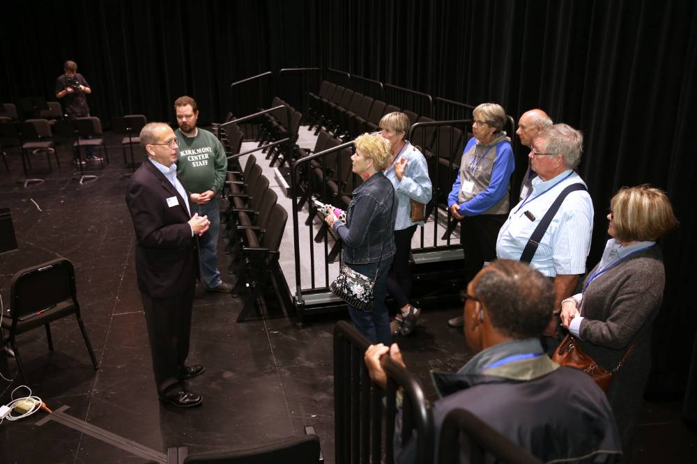 Class of '68 takes a tour of the black box in the Performing Arts Center.